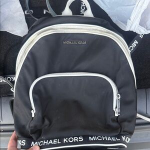 Michael Kors Sport Connie Medium Backpack in black nylon with white leather